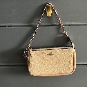 Cream Coach wristlet with gold chain